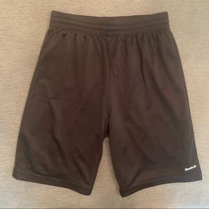 Reebok gray athletic mesh shorts.